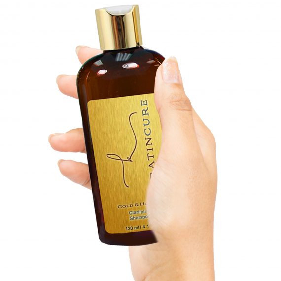 Gold Honey Clarifying Shampoo 120ml in hand